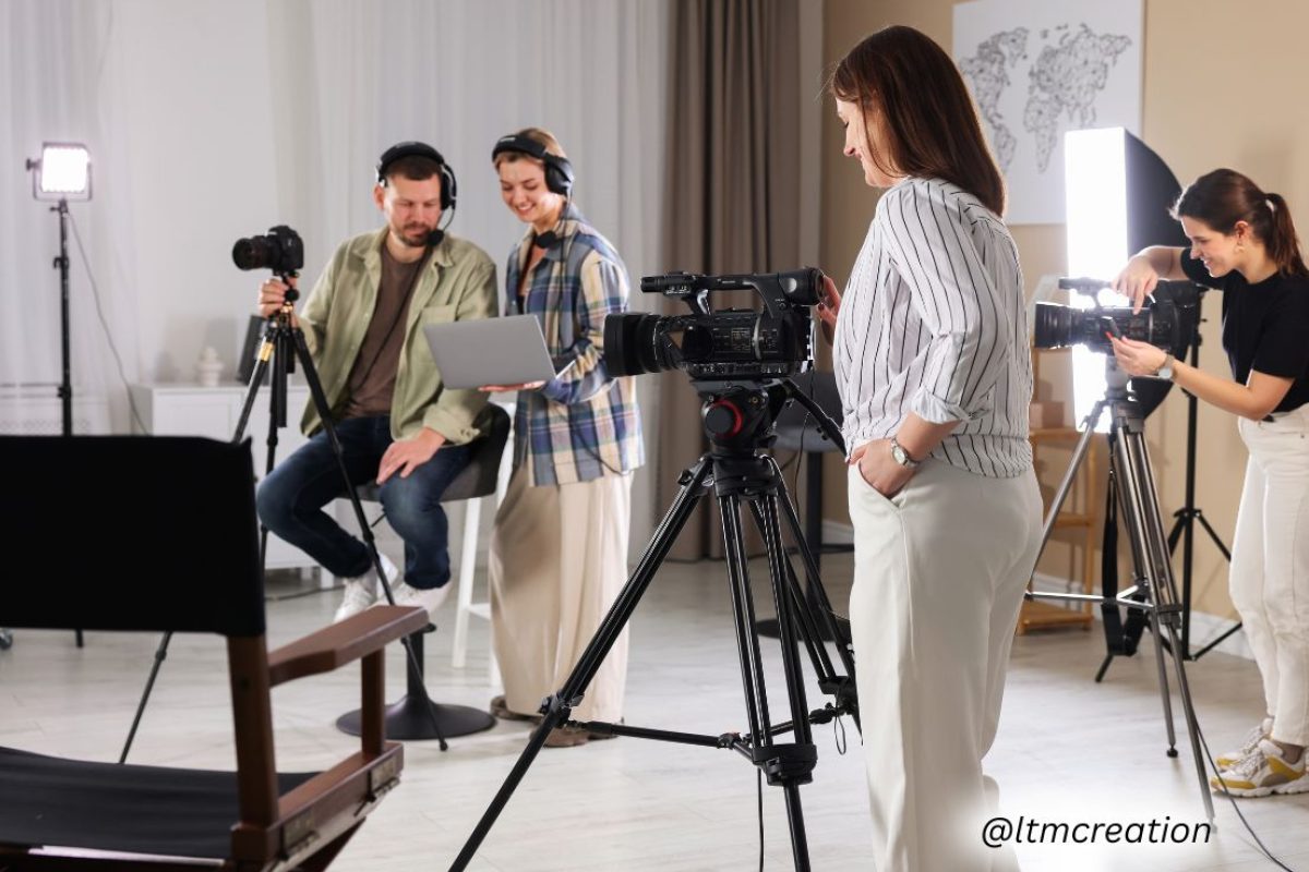 Corporate team filming a brand story video with professional lighting and camera setup.